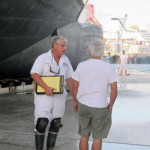 A blue and white seal with the words society of accredited marine surveyors.