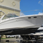 A boat is parked in the dock of a marina.